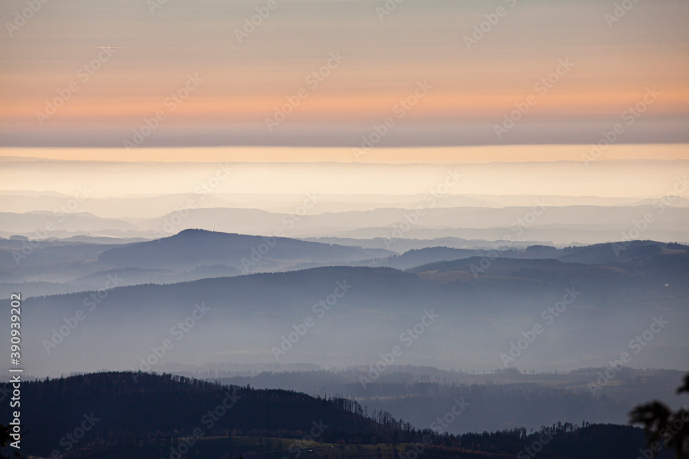 cloudy sky over misty mountain hills at sunset pastel colours landscape cloudy sky over misty mountain hills at sunset pastel colours landscape