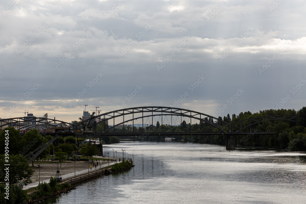 Bridge on the river and cloudy sky
