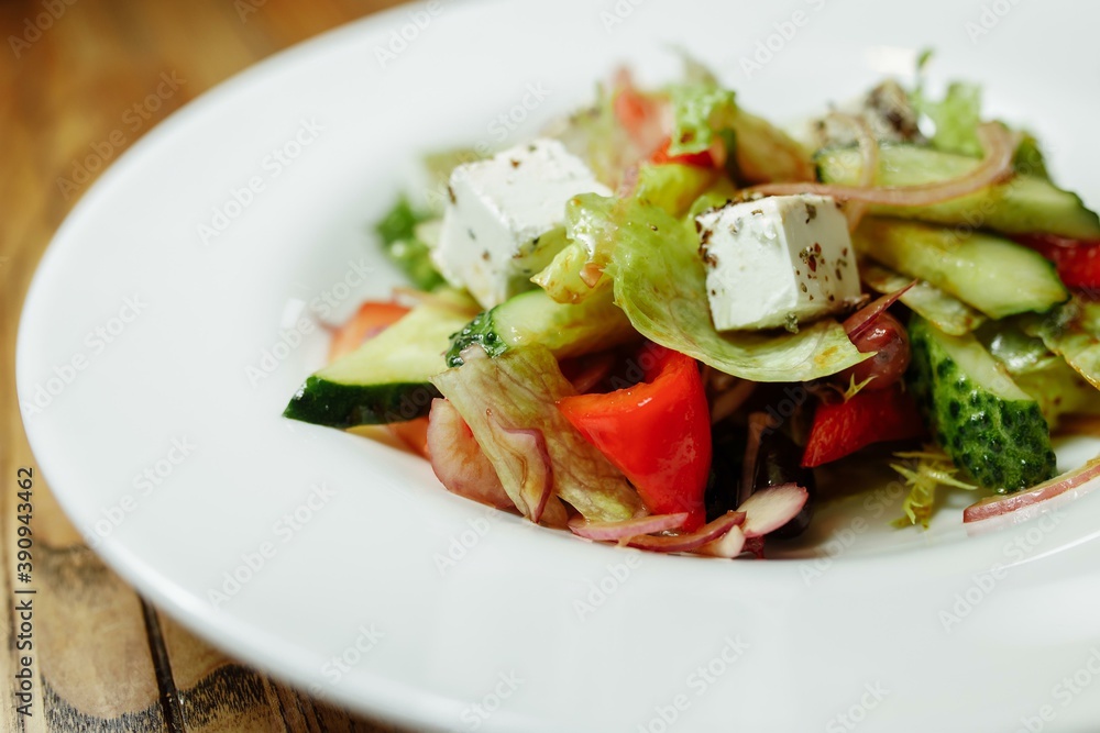 Greek salad on wooden background top view. Space for text. Healthy food Greek salad on wooden background top view. Space for text. Healthy food
