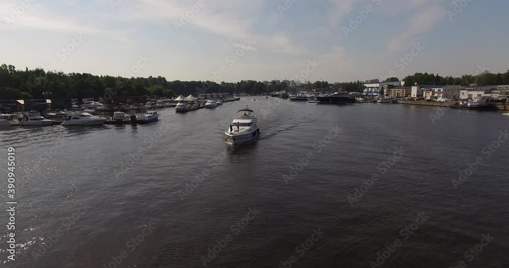 4K high quality calm windless bright summer morning aerial video of Moscow Channel yacht club embankment, green trees, wooden pier and shore with moored anchored boats and yachts near Moscow, Russia 4K high quality calm windless bright summer morning aerial video of Moscow Channel yacht club embankment, green trees, wooden pier and shore with moored anchored boats and yachts near Moscow, Russia