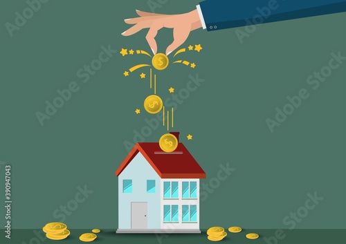 Saving  money. A hand putting coins in home model.The coins in the home for save money.investment,bank,finance,Photo financial saving and Saving . 