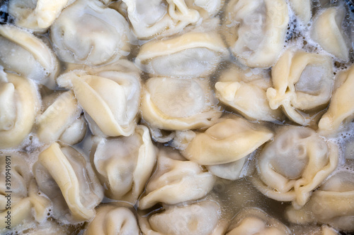 Fresh meat dumplings closeup background.