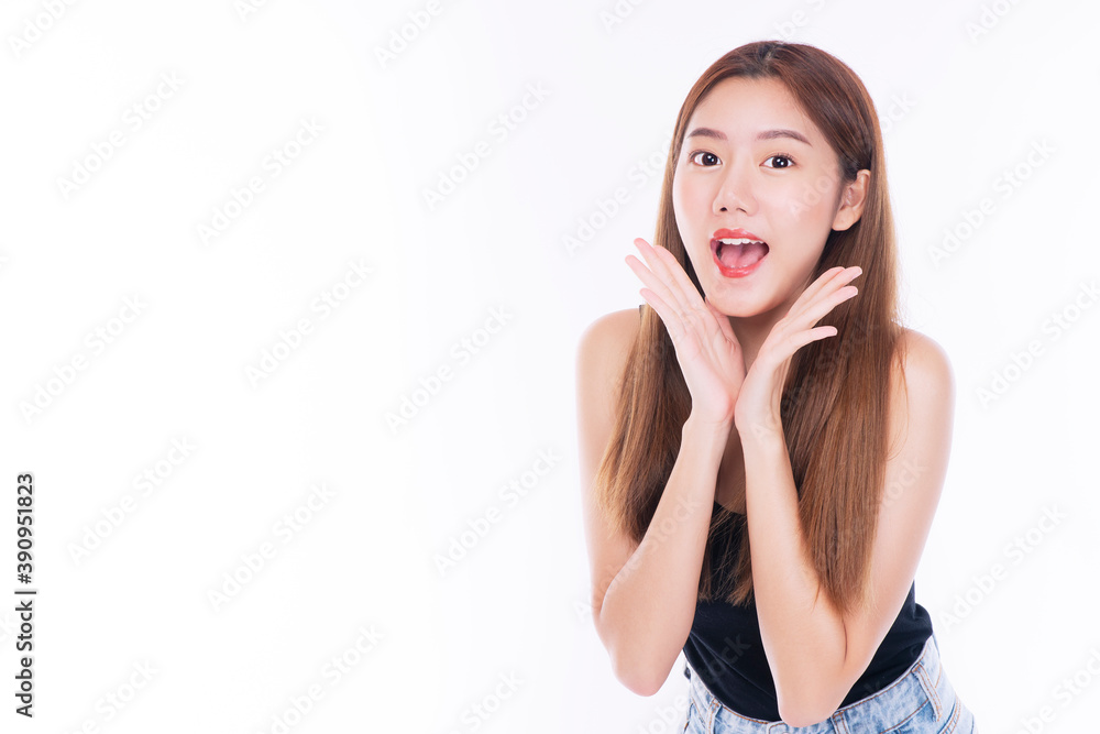 Young woman with surprised excited screaming while looking at product on sale promotion over isolated white background. Cheerful girl funny joyful face shouting wow expression with copy space. Young woman with surprised excited screaming while looking at product on sale promotion over isolated white background. Cheerful girl funny joyful face shouting wow expression with copy space.