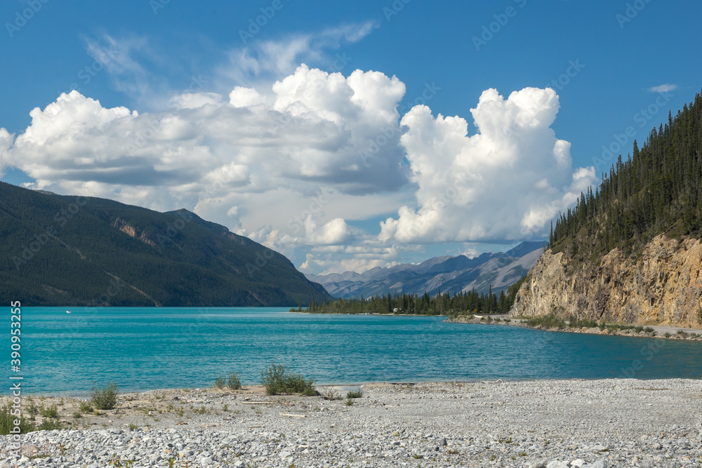 Beautiful turquoise color lake in summer. Muncho lake in British Columbia, Canada
