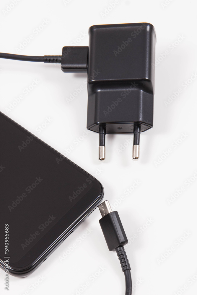 Mobile phone and charger with plug. Smartphone charging Mobile phone and charger with plug. Smartphone charging