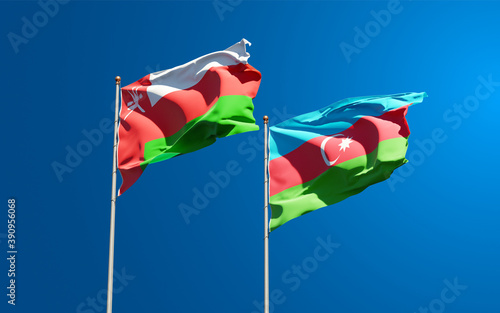 Beautiful national state flags of Oman and Azerbaijan together at the sky background. 3D artwork concept.