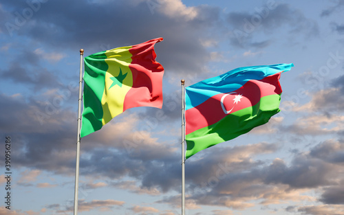 Beautiful national state flags of Senegal and Azerbaijan together at the sky background. 3D artwork concept.