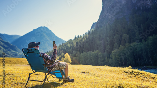 person using mobile phone in the wild
