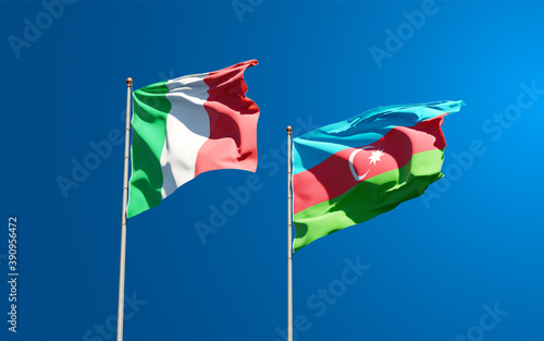 Beautiful national state flags of Italy and Azerbaijan together at the sky background. 3D artwork concept.