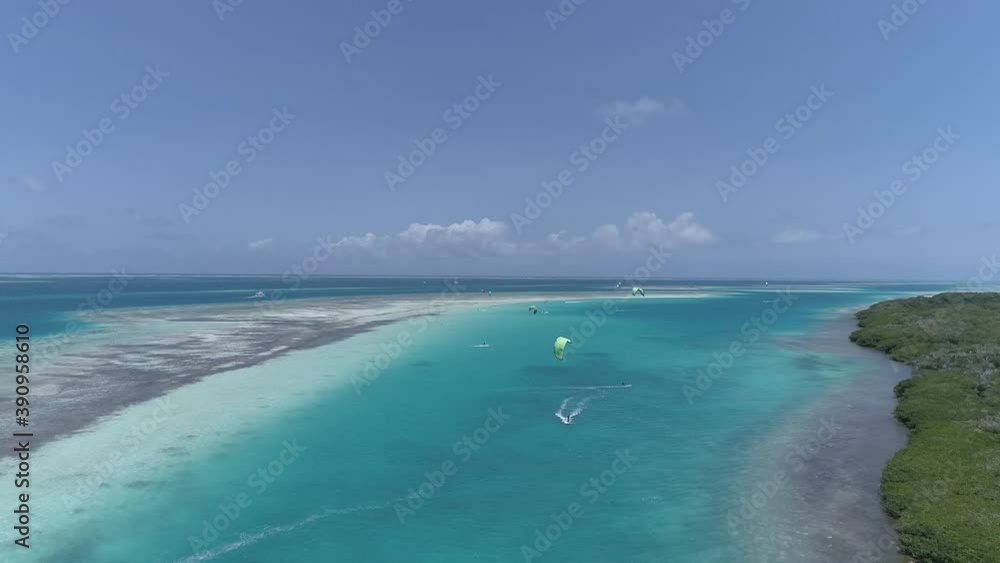 Aerial View kitesurfer of caribbean sea in esparky Los Roques, Venezuela. Kitesurfing and windsurfing in a paradisiac beach. Cool sports. Aerial View kitesurfer of caribbean sea in esparky Los Roques, Venezuela. Kitesurfing and windsurfing in a paradisiac beach. Cool sports.