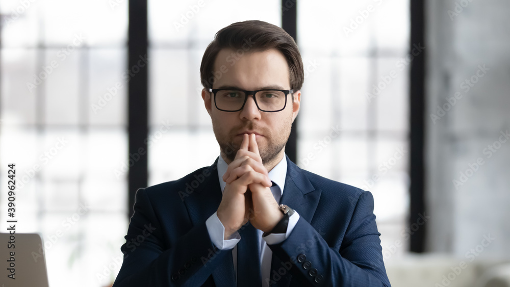 Head shot portrait of serious 30s male ceo executive manager leader in formal wear and eyeglasses, thinking of problem solution, career opportunities or business challenges looking at camera. Head shot portrait of serious 30s male ceo executive manager leader in formal wear and eyeglasses, thinking of problem solution, career opportunities or business challenges looking at camera.