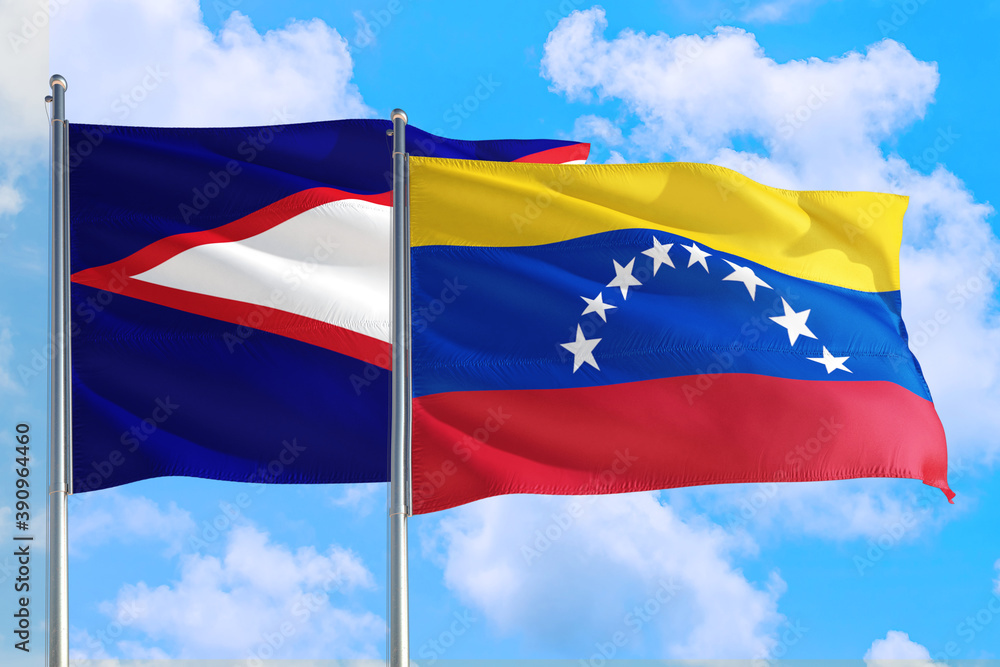 Venezuela and American Samoa national flag waving in the windy deep blue sky. Diplomacy and international relations concept. Venezuela and American Samoa national flag waving in the windy deep blue sky. Diplomacy and international relations concept.