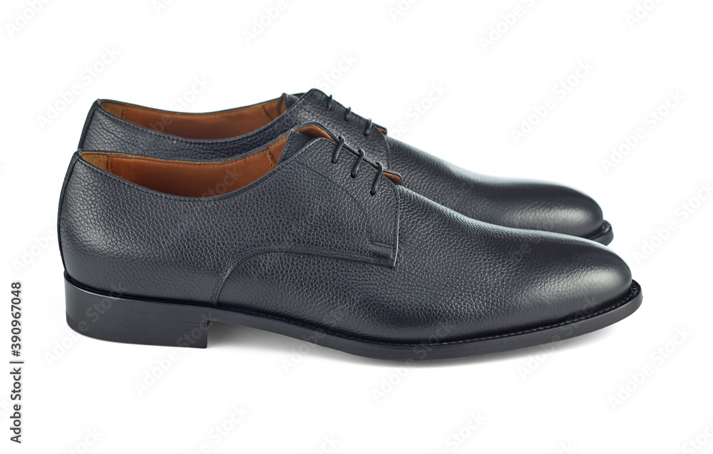 Beautiful pair of classic men's black leather shoes on lace, isolated on a white background with a shadow. Side view. Beauty and elegance of natural materials. Beautiful pair of classic men's black leather shoes on lace, isolated on a white background with a shadow. Side view. Beauty and elegance of natural materials.