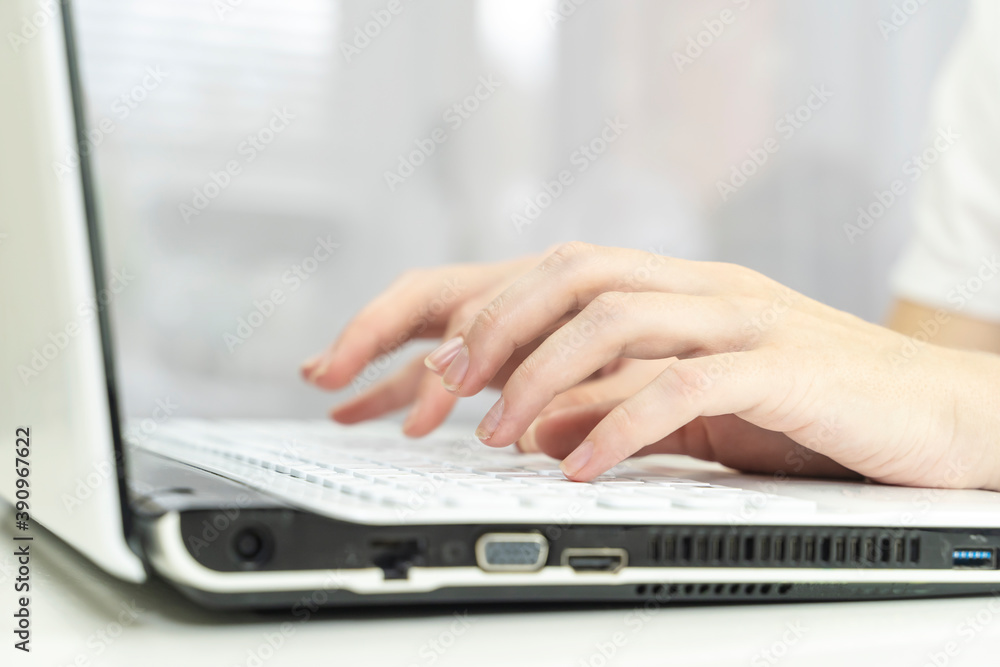 girl's hands on the laptop keyboard girl's hands on the laptop keyboard