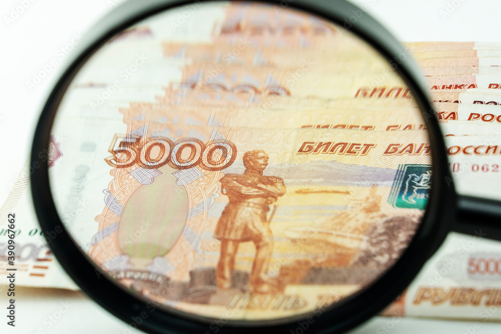 Fototapeta premium magnifying glass and Russian money