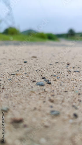 selective focus on sand on road