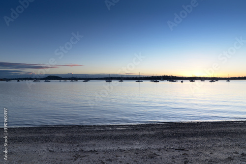 Sailboats in the lake during the sunset photo