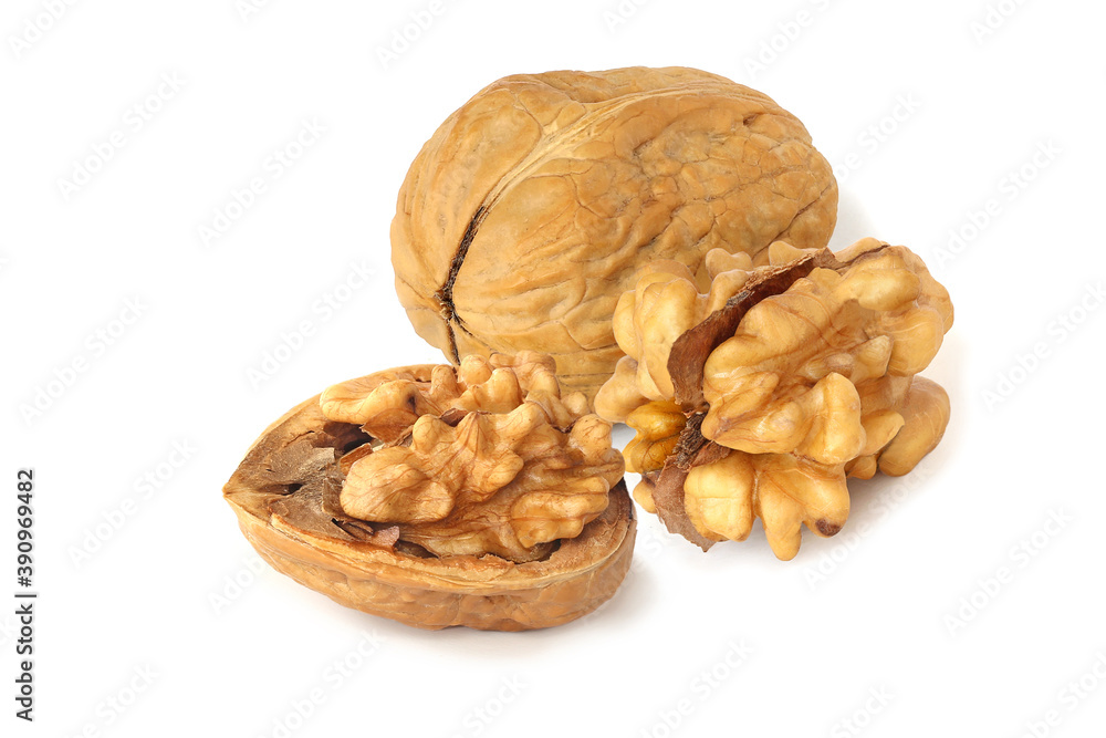 Walnut with half and whole core isolated on the white Walnut with half and whole core isolated on the white