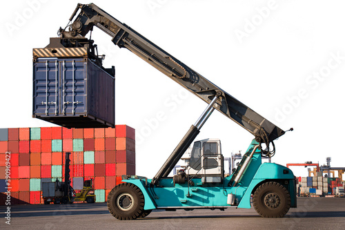 blue reach stacker transport cargo container parking with clipping path, Container commercial port, Logistics and transportation of Container Cargo and Cargo logistic import export background and tran photo