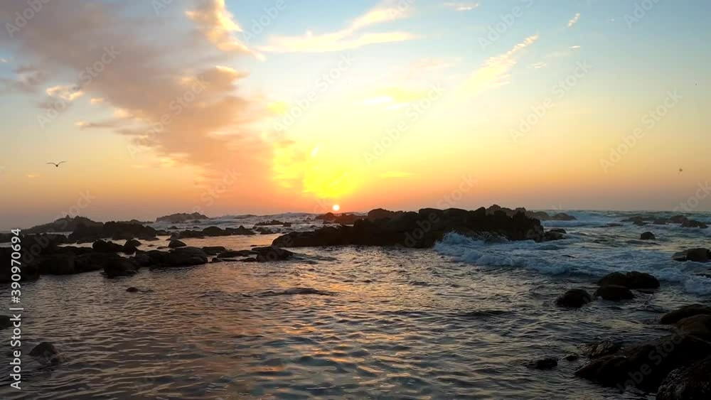 Relaxing nature video of the California sun setting below the horizon on the rocky coastal landscape of Monterey Bay, California. Asilomar State Beach in 4K. Relaxing nature video of the California sun setting below the horizon on the rocky coastal landscape of Monterey Bay, California. Asilomar State Beach in 4K.