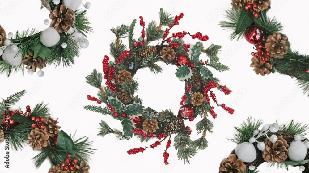 Digital animation of decorating several Christmas wreaths on a white background. Rotate axes. Merry Christmas and Happy New Year celebration tradition concept Digital animation of decorating several Christmas wreaths on a white background. Rotate axes. Merry Christmas and Happy New Year celebration tradition concept