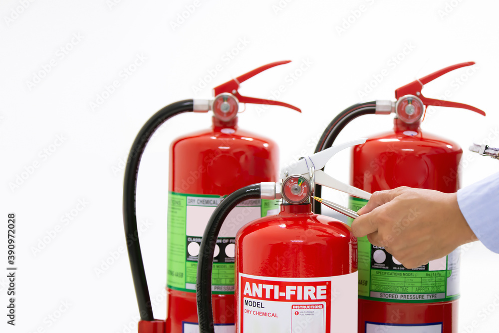 Obraz premium Fire protection engineering checking inspection services the red fire extinguishers tank in the building concepts of prevent emergency and safety rescue and fire training.
