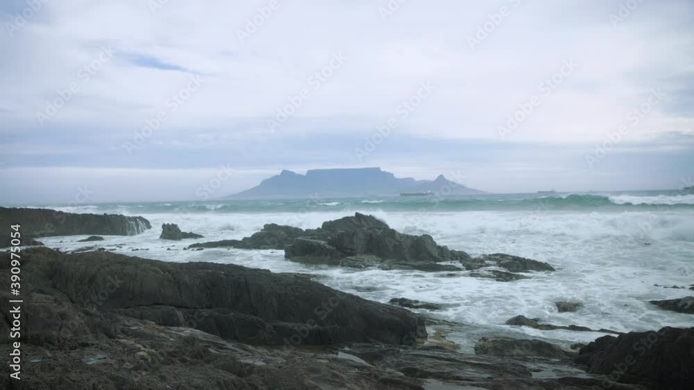 Cape Town's Table Mountain as seen from across the bay. Cold and Cloudy Winter day. Cape Town's Table Mountain as seen from across the bay. Cold and Cloudy Winter day.