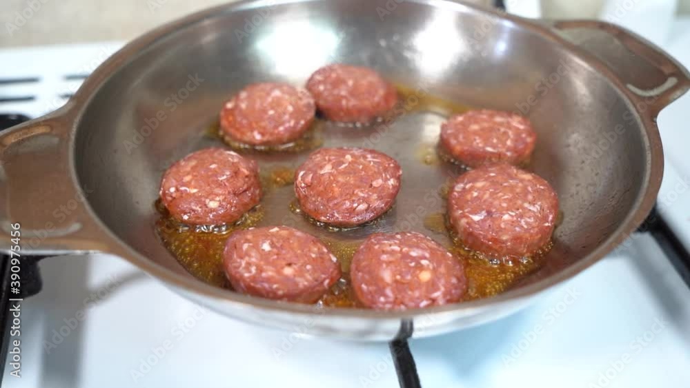 sausages are cooked in a pan sausages are cooked in a pan