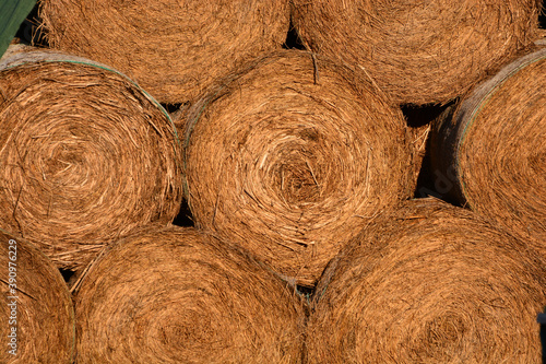 close up of hay bales stacked together 