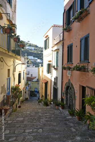 Картината върху платно A narrow street among the old houses of Massa Lubrense, un villaggio di pescatori nella regione Campania, Italy