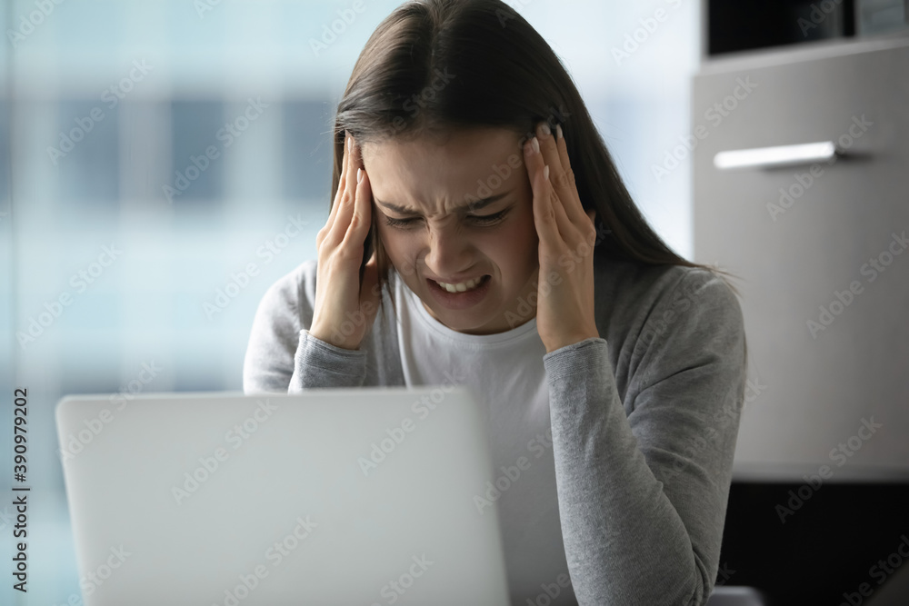 It is not going to work. Nervous millennial lady corporate worker hugging head in panic before laptop screen beating herself up for critical error, young woman suffering of sudden headache at office It is not going to work. Nervous millennial lady corporate worker hugging head in panic before laptop screen beating herself up for critical error, young woman suffering of sudden headache at office