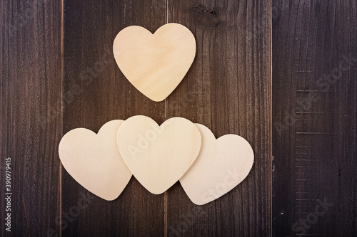 Beautiful paper hearts on wood background