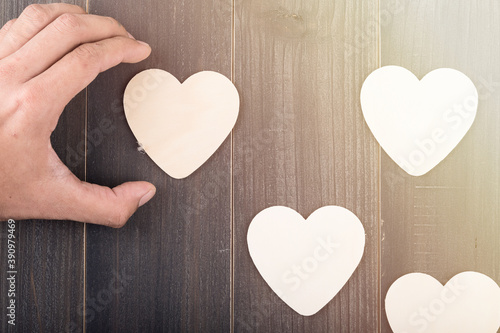 Beautiful paper hearts on wood background