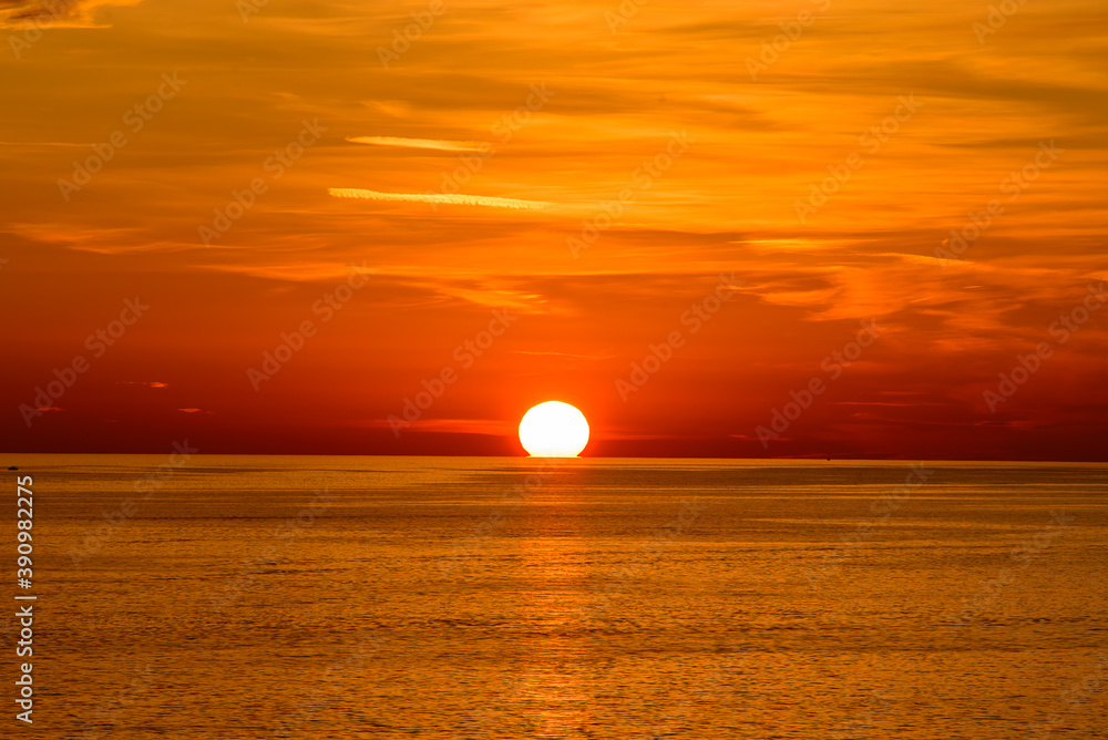 Sunset on the sea with orange clouds