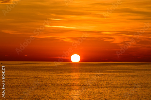 Fototapeta Naklejka Na Ścianę i Meble -  Sunset on the sea with orange clouds