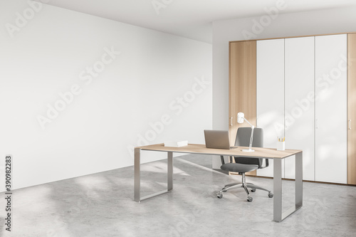 White and wooden CEO office corner