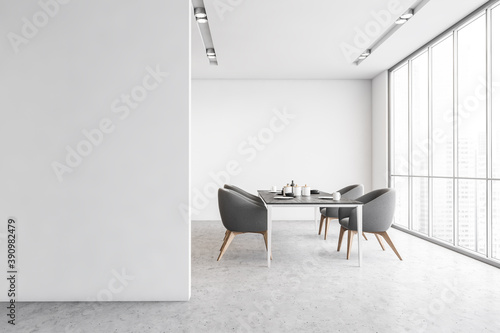 Grey armchairs and table in white room with mockup copy space, minimalist loft © ImageFlow