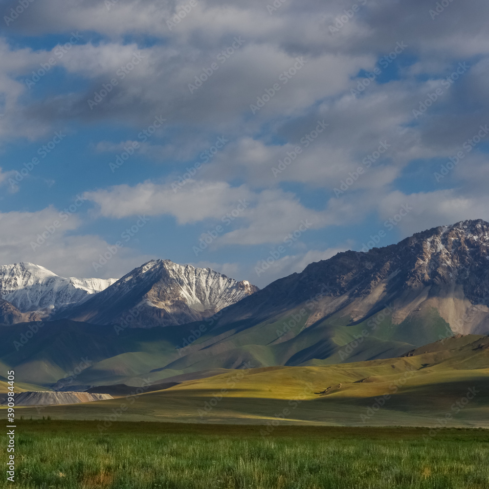 View of the countryside near Sary Tash in southern Kyrgyzstan with snow-capped Alay or Alai mountain range in the backdrop