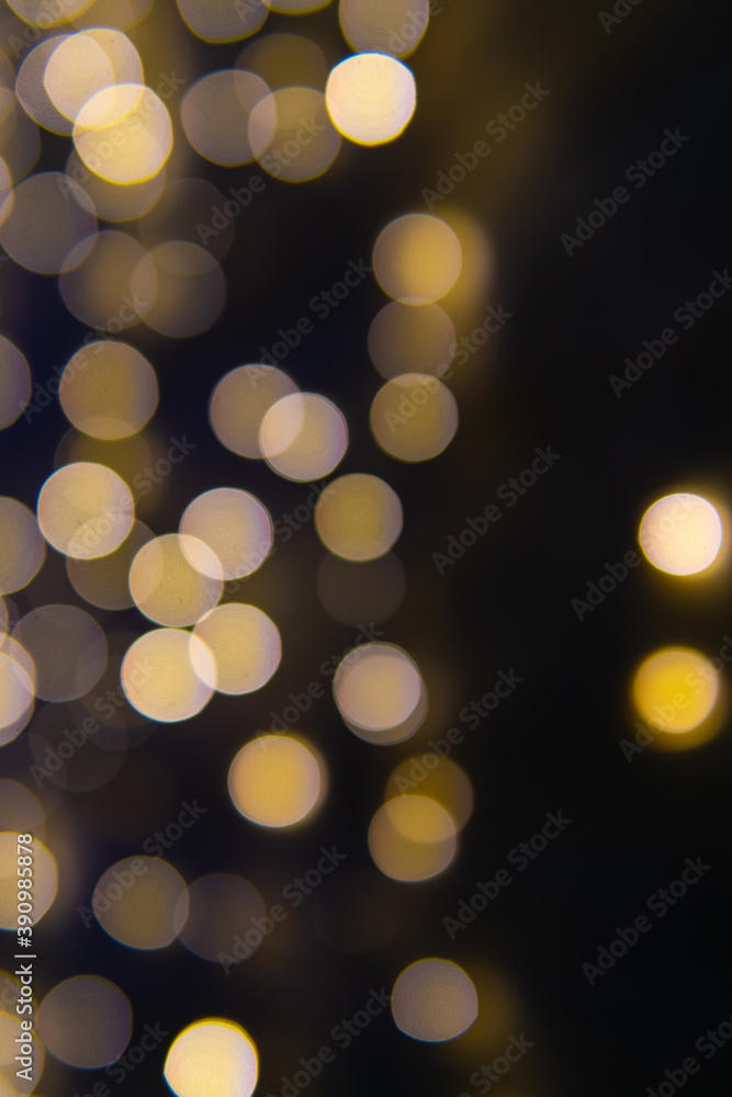 Background of New Year's garlands like stars. Christmas atmosphere with garlands in defocus.