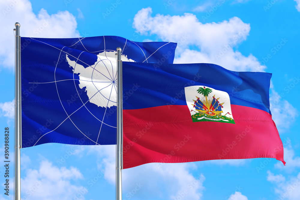 Naklejka premium Haiti and Antarctica national flag waving in the windy deep blue sky. Diplomacy and international relations concept.