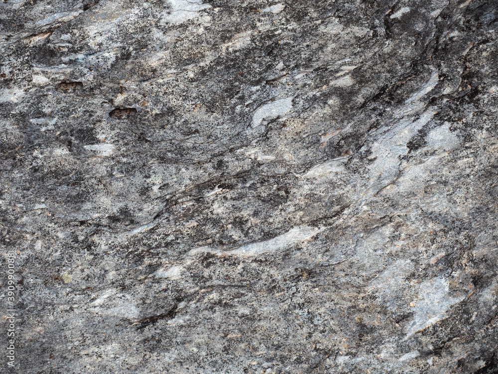 Naklejka premium Closeup of rock surface, black and white stain pattern