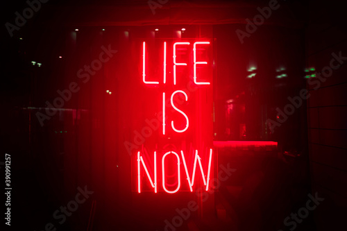 Photography Red neon sign life is now