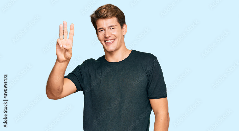 Handsome caucasian man wearing casual clothes showing and pointing up with fingers number three while smiling confident and happy. Handsome caucasian man wearing casual clothes showing and pointing up with fingers number three while smiling confident and happy.