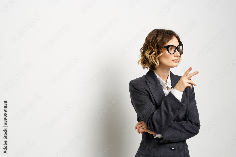 confident business woman in suit gesturing with hands work light background confident business woman in suit gesturing with hands work light background