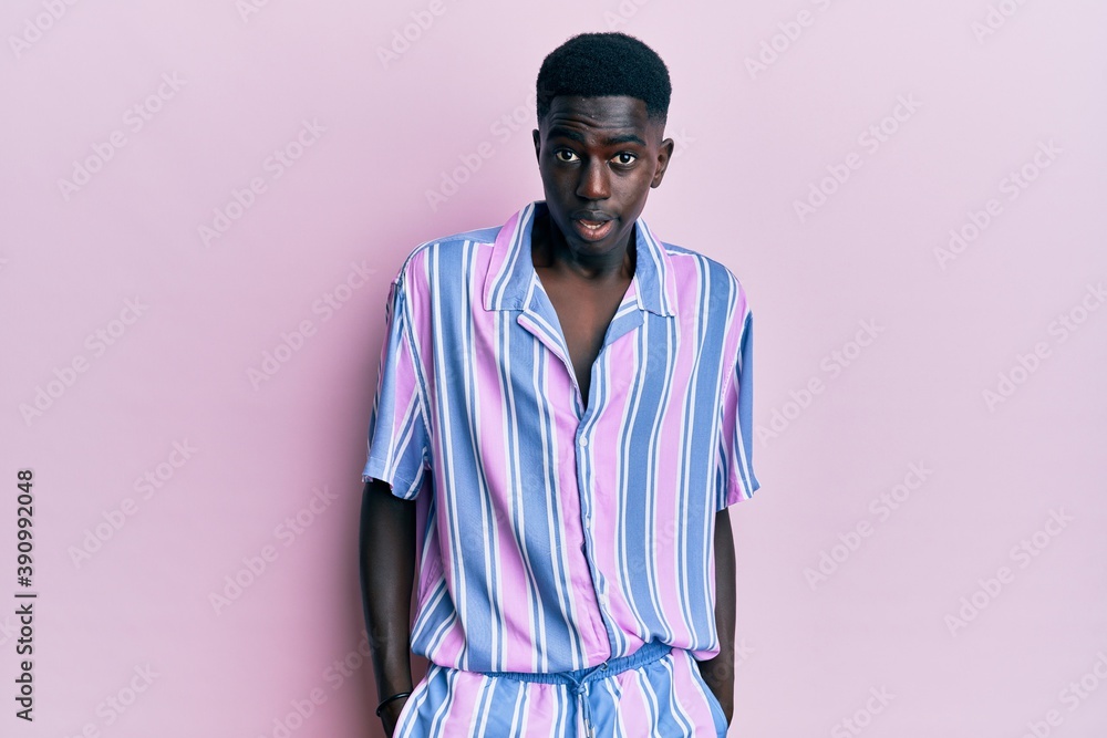 Young african american man wearing casual clothes clueless and confused expression. doubt concept. Young african american man wearing casual clothes clueless and confused expression. doubt concept.
