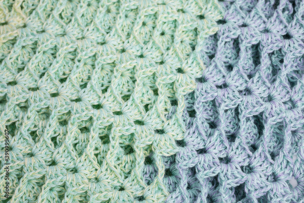 handmade multicolor crochet background in green and blue with double crochet stitches handmade multicolor crochet background in green and blue with double crochet stitches