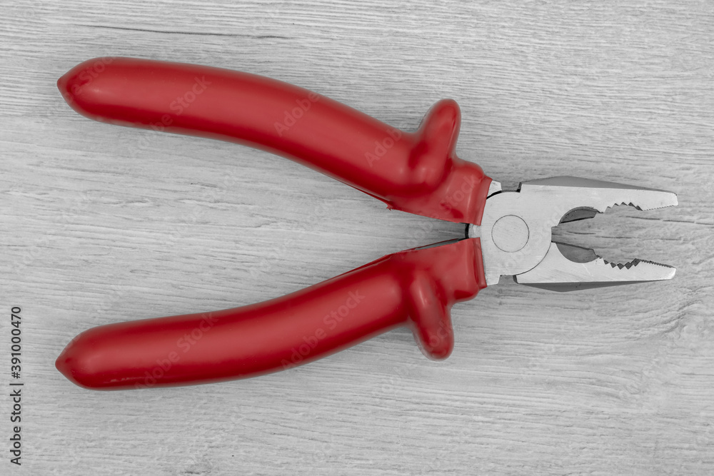 Metal pliers with rubber grips. Pliers background. Metal pliers with rubber grips. Pliers background.