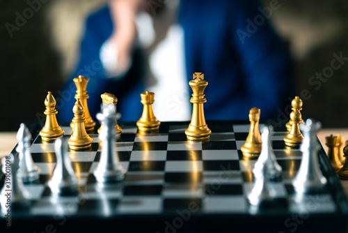 close up business man formal suit hand think and planing to win chess board game business stratey organize and management ideas concept photo