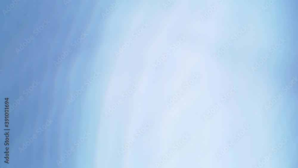 Top view slow motion of drop falling into the water surface and diverging circles on white background Top view slow motion of drop falling into the water surface and diverging circles on white background