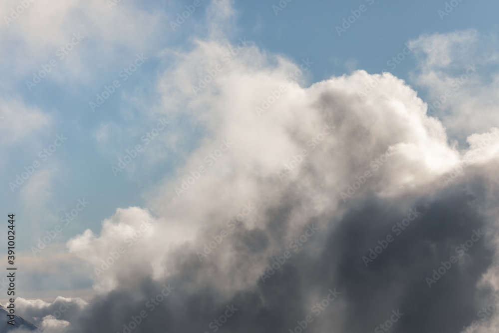 Clouds gathering in the blue sky